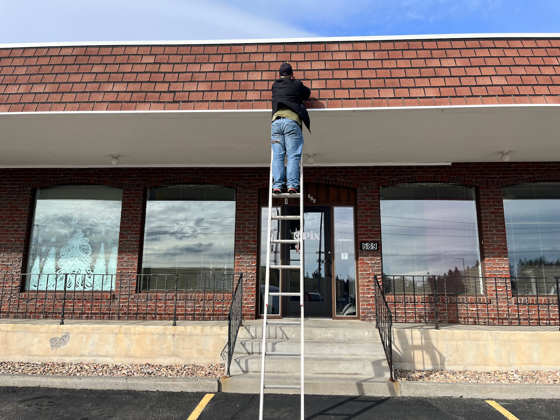 We took an extension ladder today so we could measure the roof line to get our name as big as possible up there… want everyone to see us from the road.