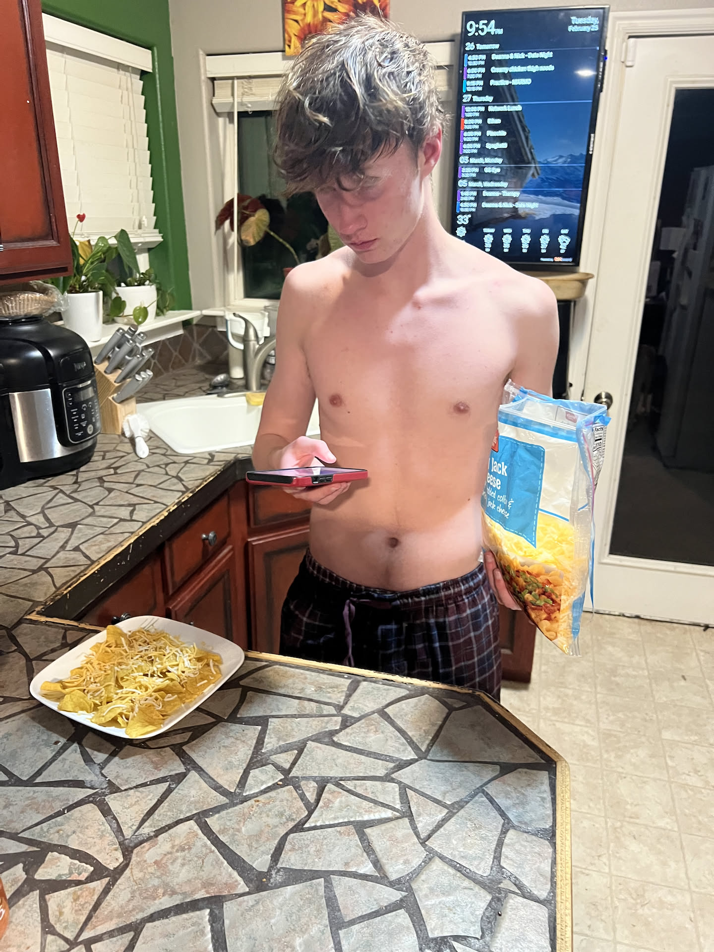 Avery has hockey practice again tonight, when he got home and showered, he made a plate of super nachos for a snack.