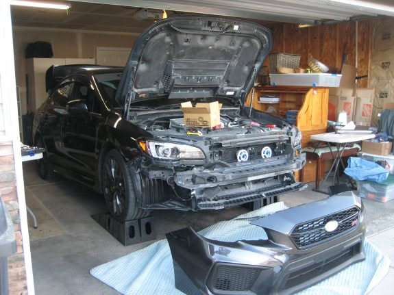 Tyson gave us a project for the day. We started taking apart his car and putting on new parts.