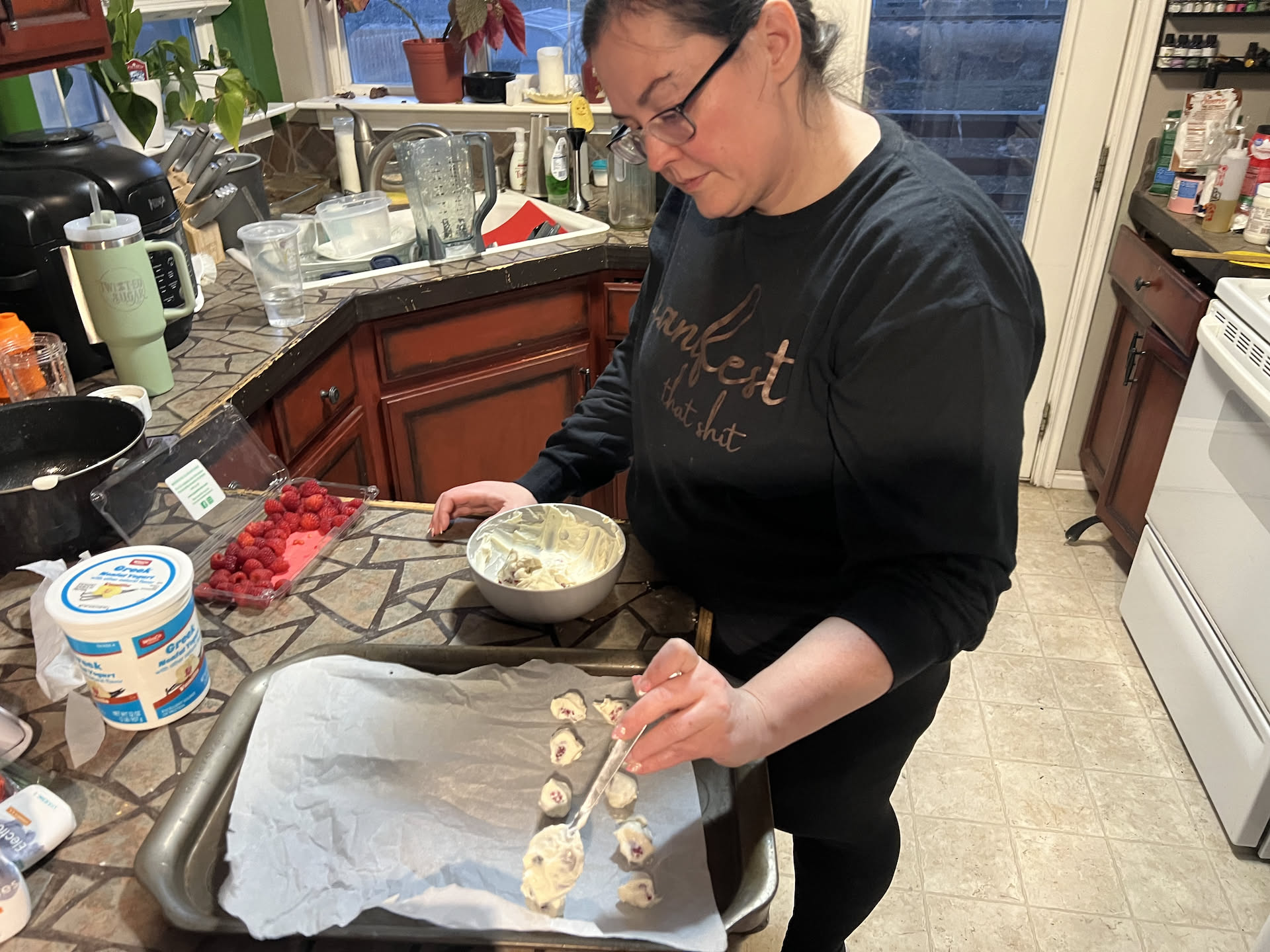 After dinner Deanna made herself some yogurt and berry bites to freeze.
