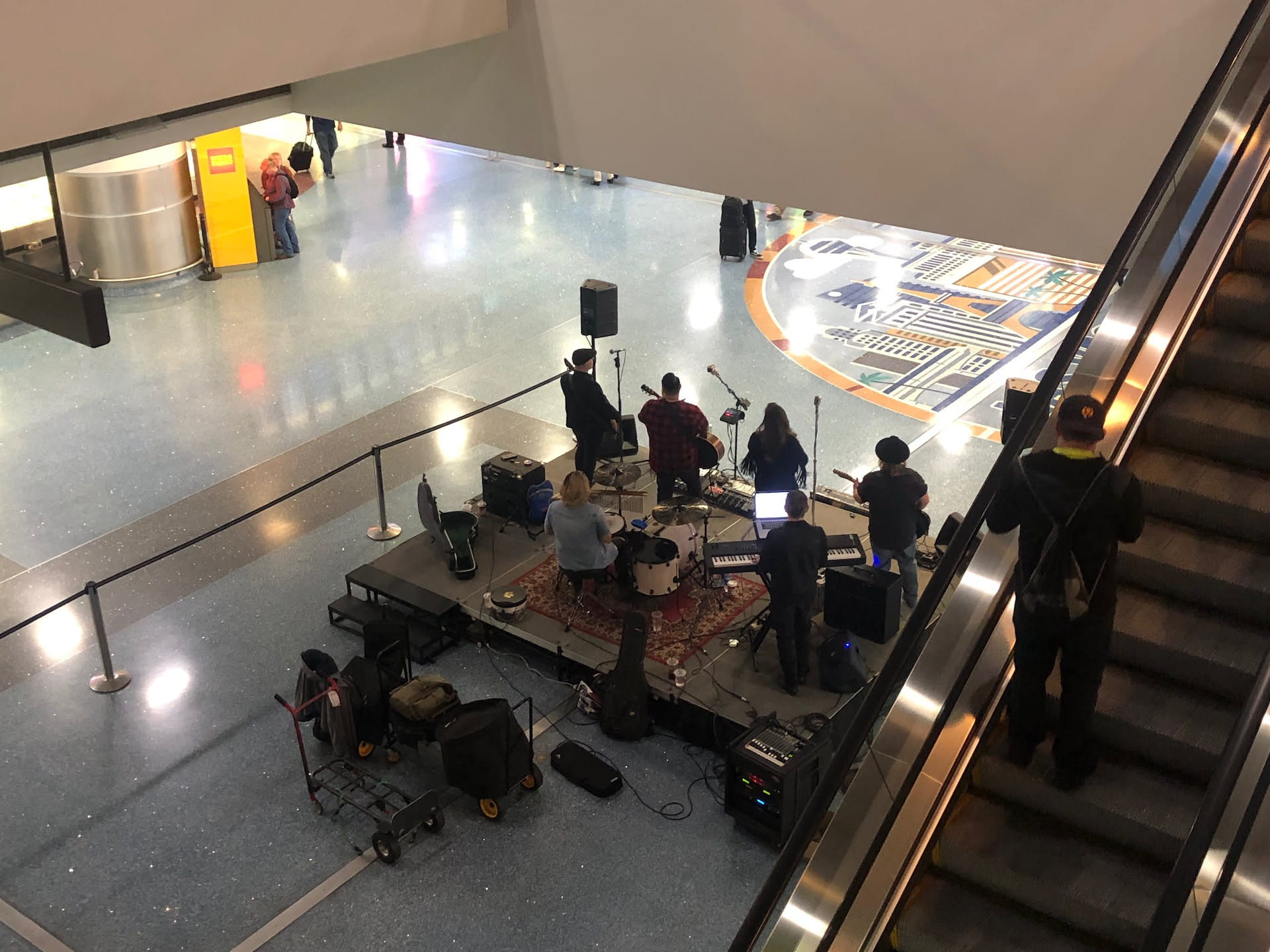 Deanna had to fly home today. My flight isn’t until tomorrow. She saw a band in the airport.