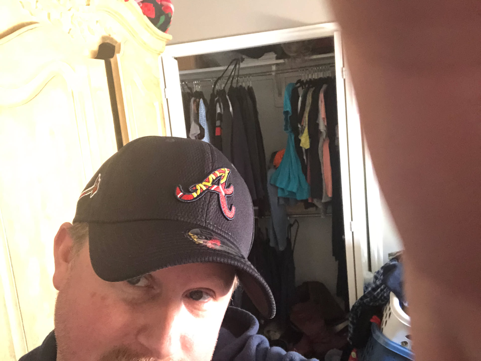 Deanna wanted to give Nick his birthday presents early… New Braves hat… whoop.