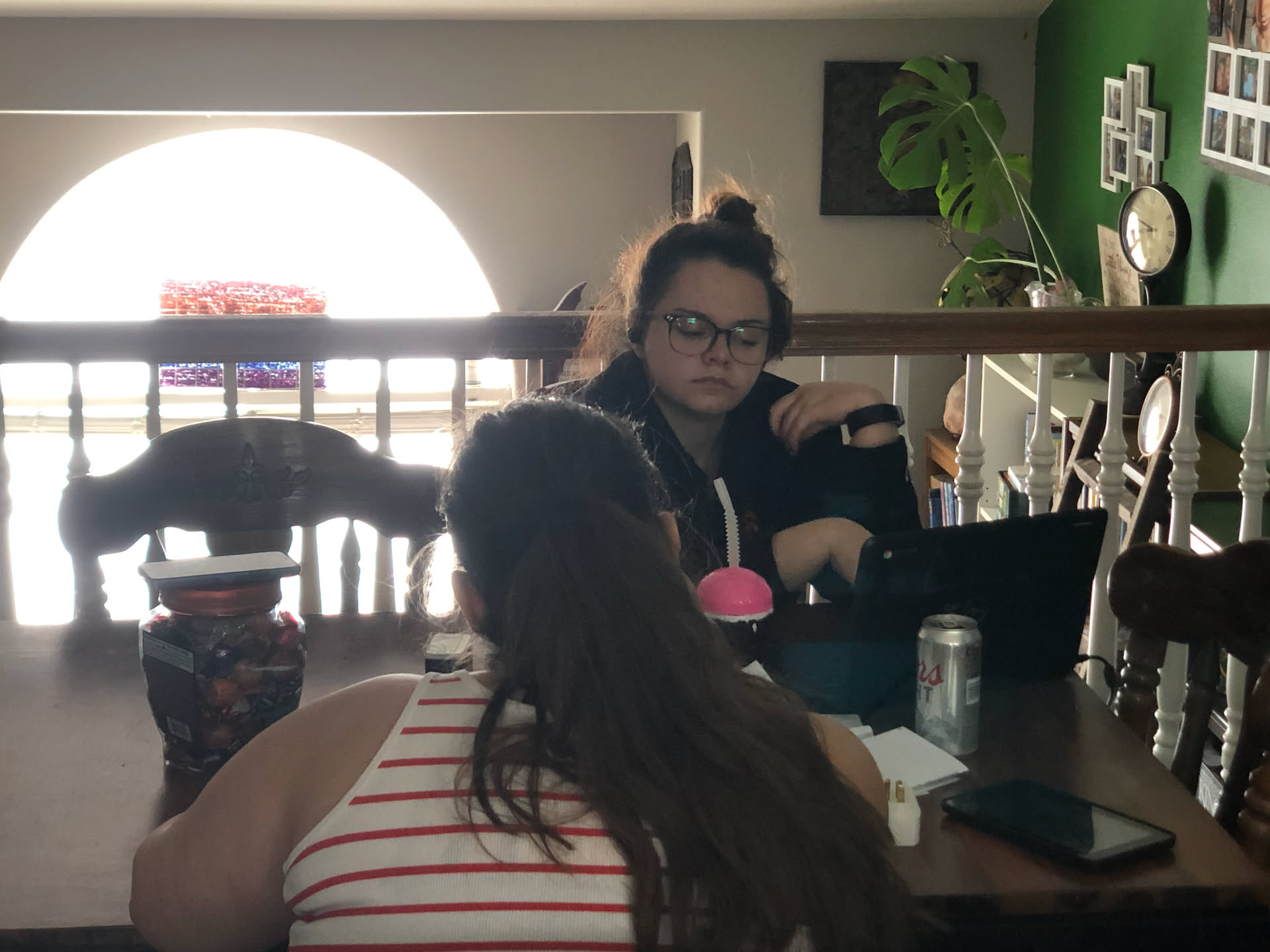 Airalynn working on homework over lunch.