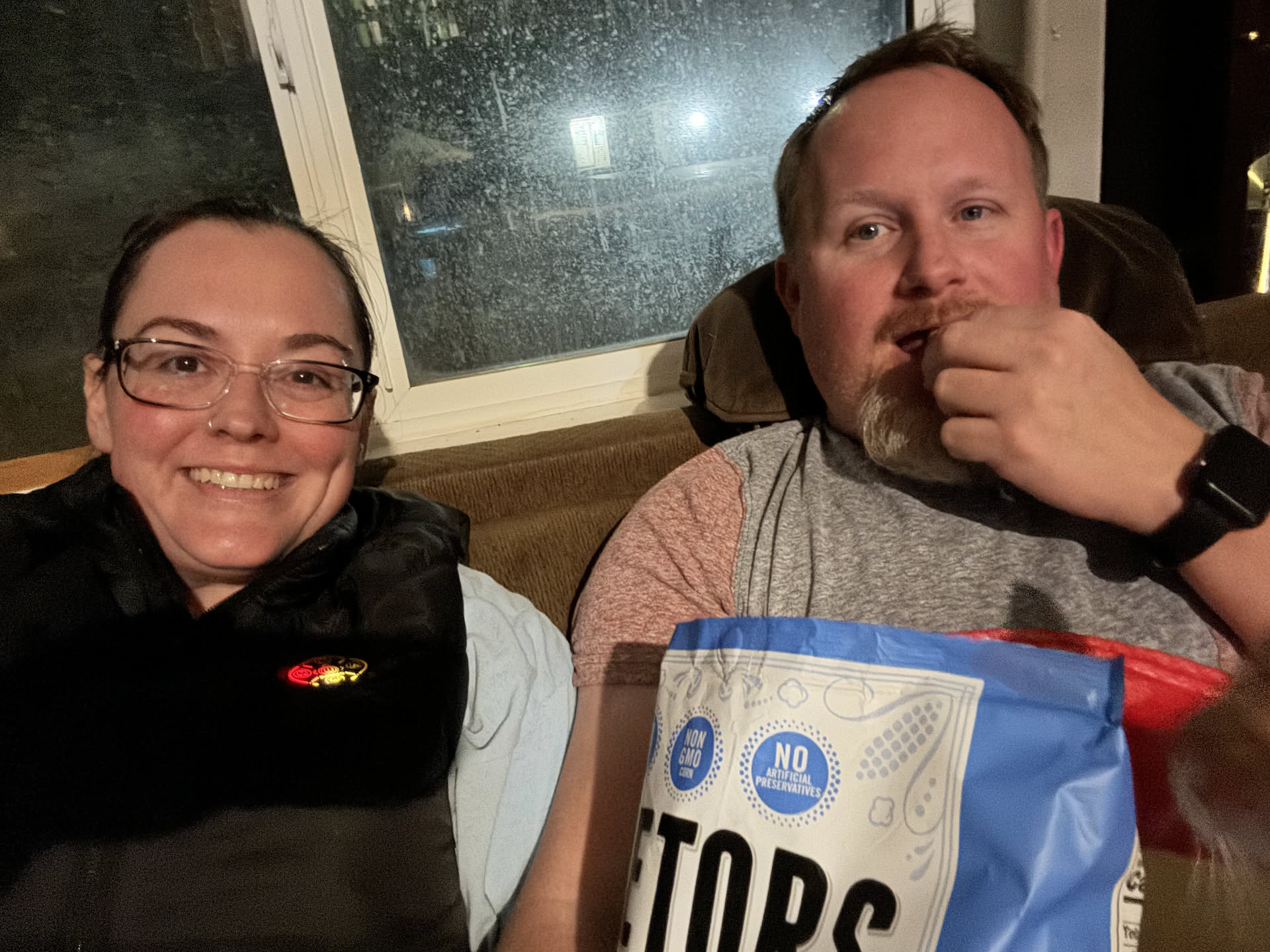 After her face mask, she Joined Nick on the couch for a little YouTube.