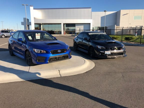 After dinner, we drove the car down to the Subaru dealership to get a side by side for a before and after… unfortunately the dark gray one was in the show room, so we parked next to a blue one.