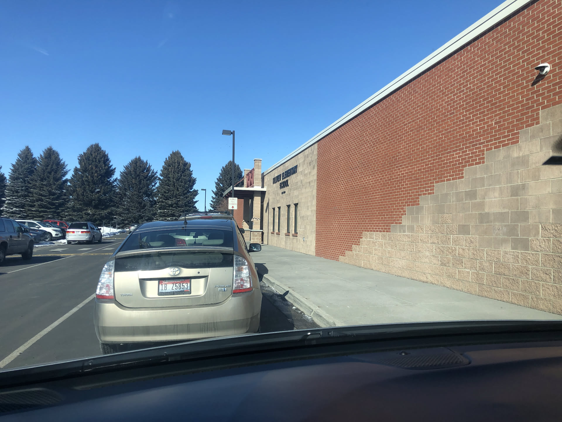 Nick waiting in the soccer mom line to pick up Ethan from school.
