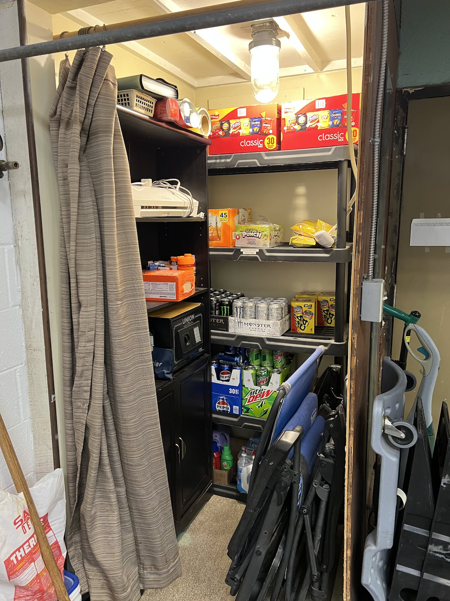 The closet is now organized with two shelves and a new light.