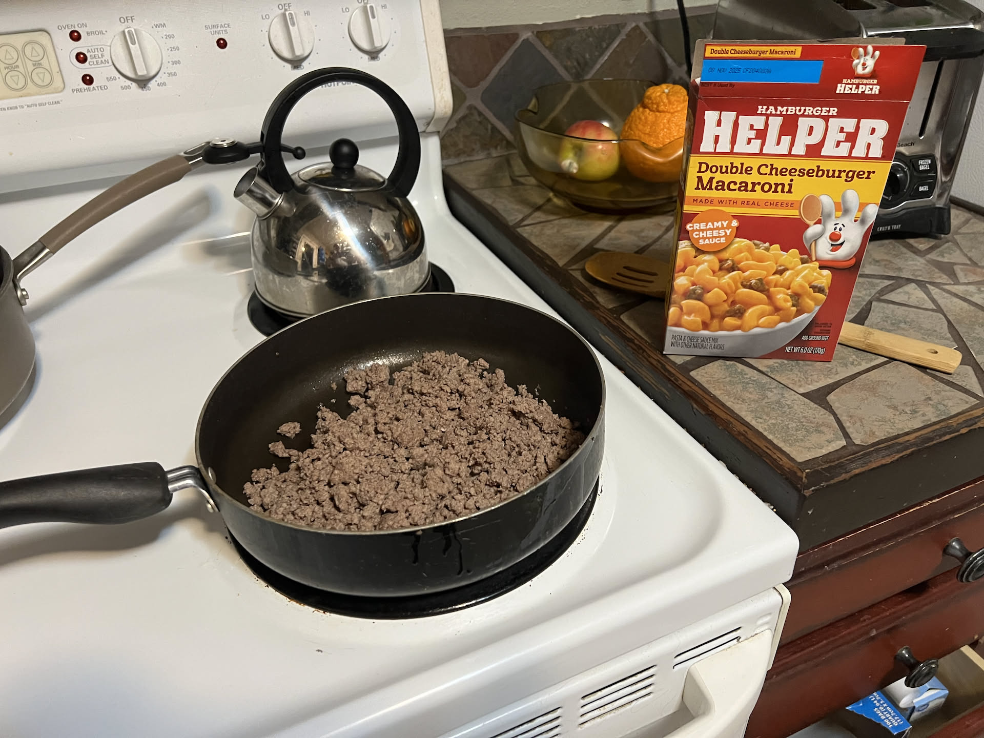 When Nick got home, he decided to make himself some Hamburger Helper.
