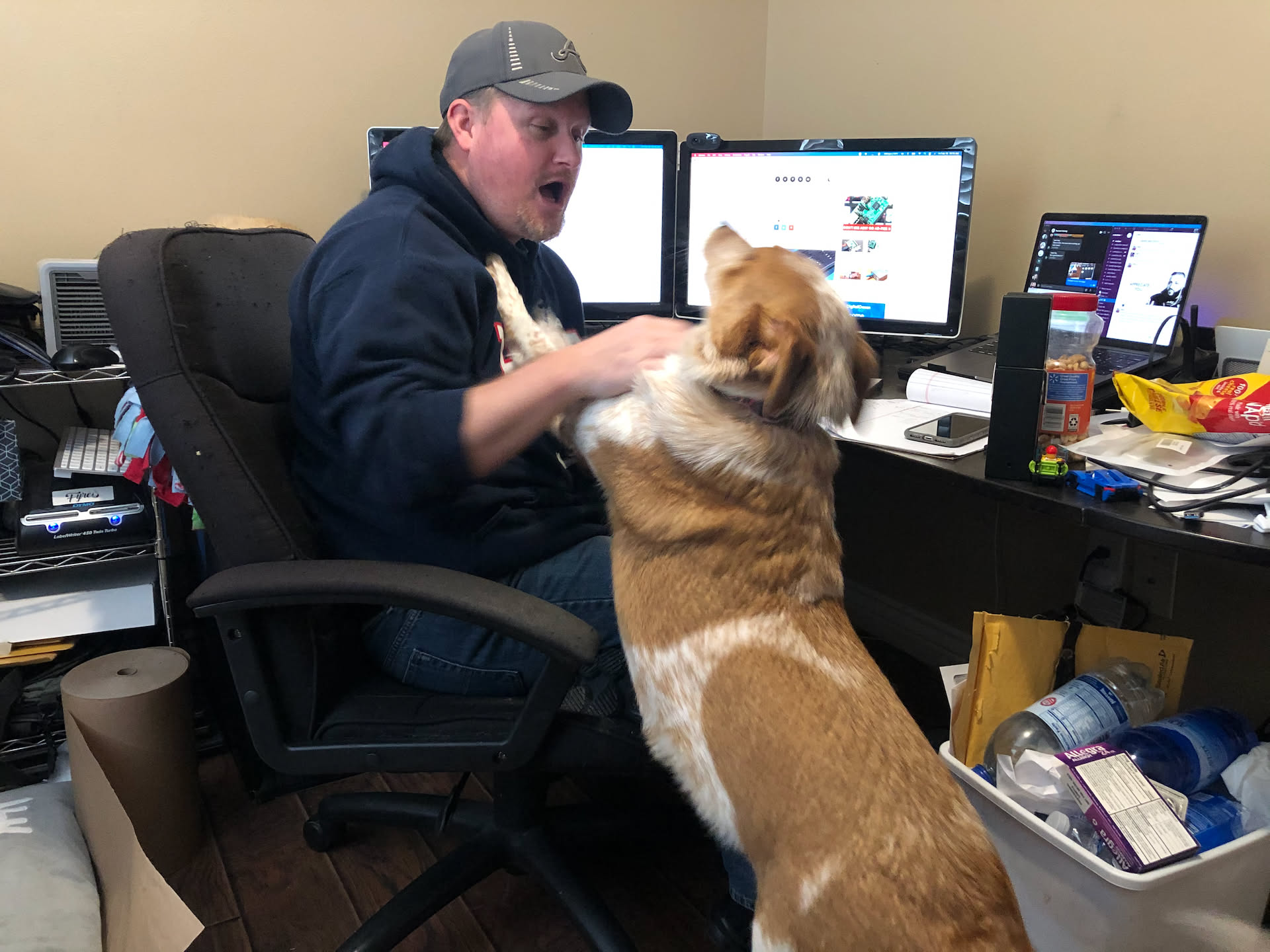 Nick playing with Loki between meetings.
