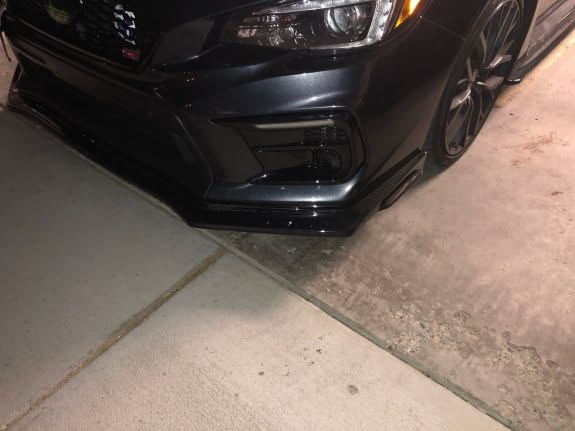 The front bumper is back on with the new bezels, fog lights and body kit… car isn’t complete, so no full pics yet.