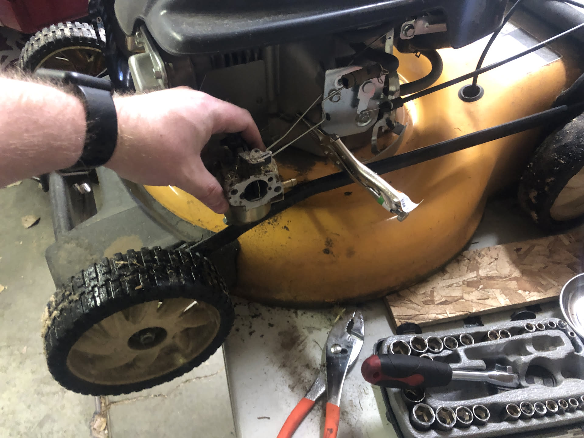 Nick started off the day early working on the new lawn mower he got, this is him taking off the carburetor.