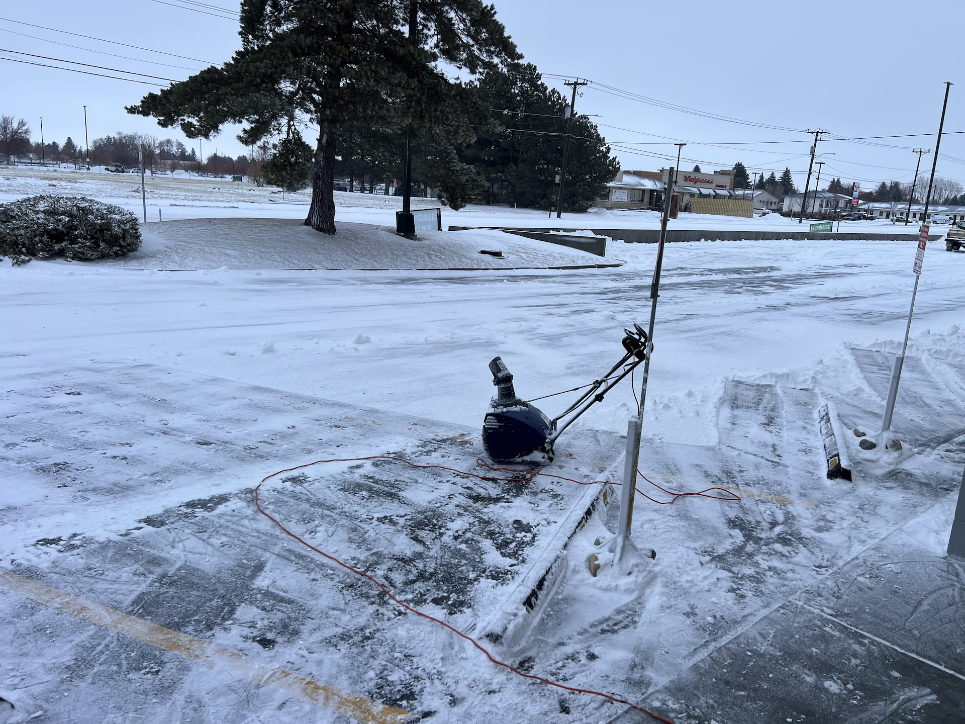 Another storm, another day of cleaning of snow in front of the business.