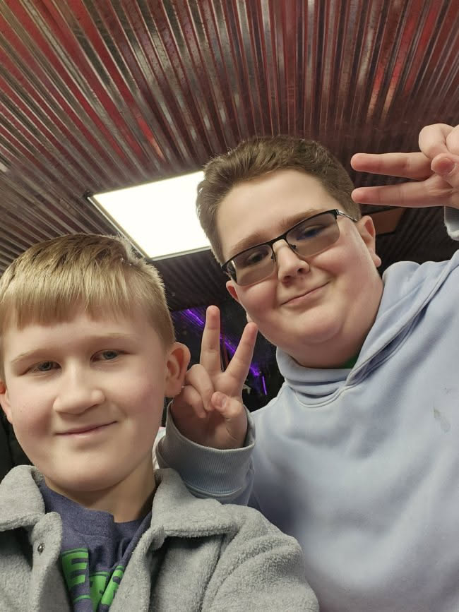 He is having a blast hanging with friends.