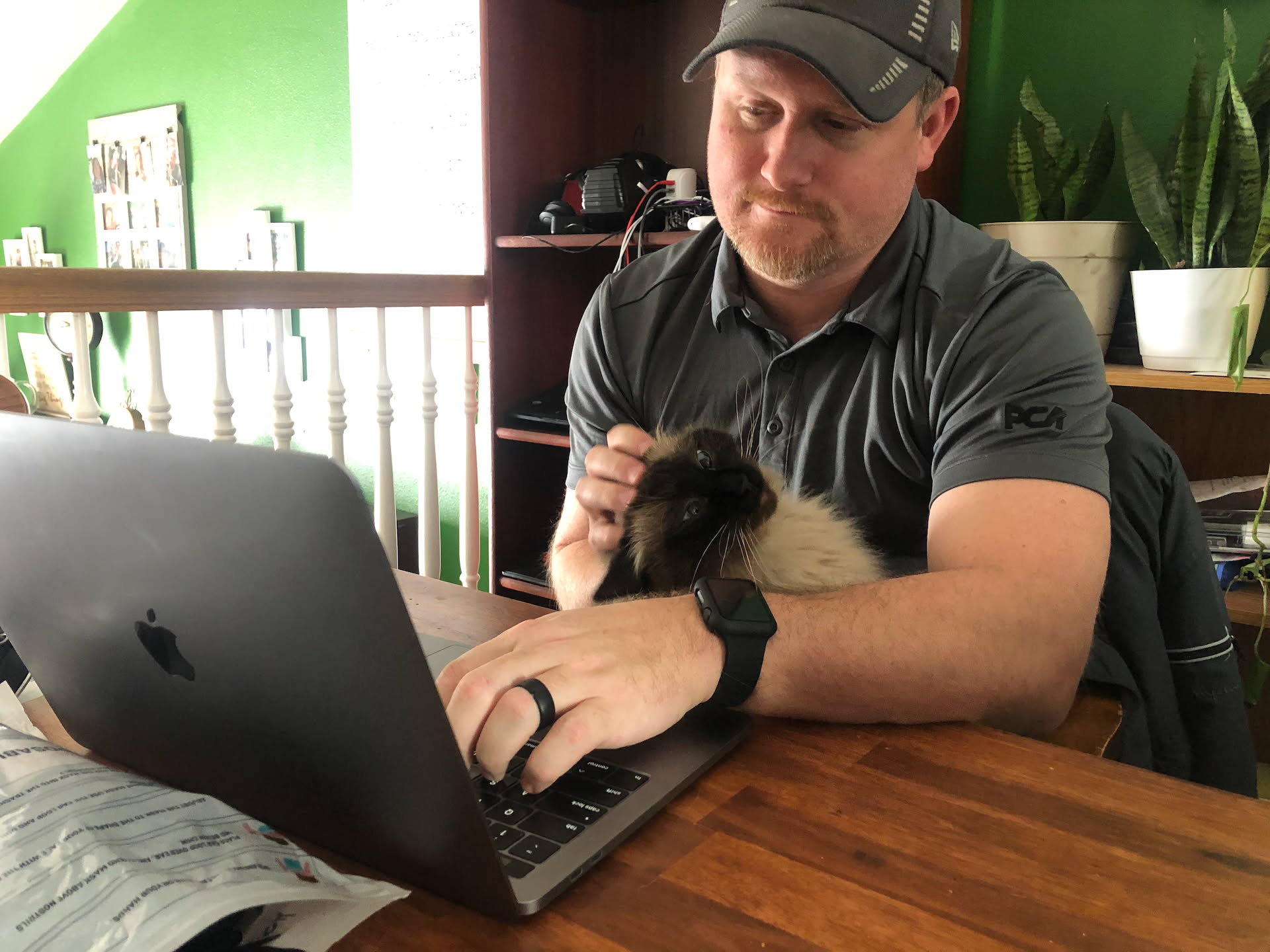 After snowblowing, Nick was working on the blog, and Oakleigh sat in his lap for a visit.