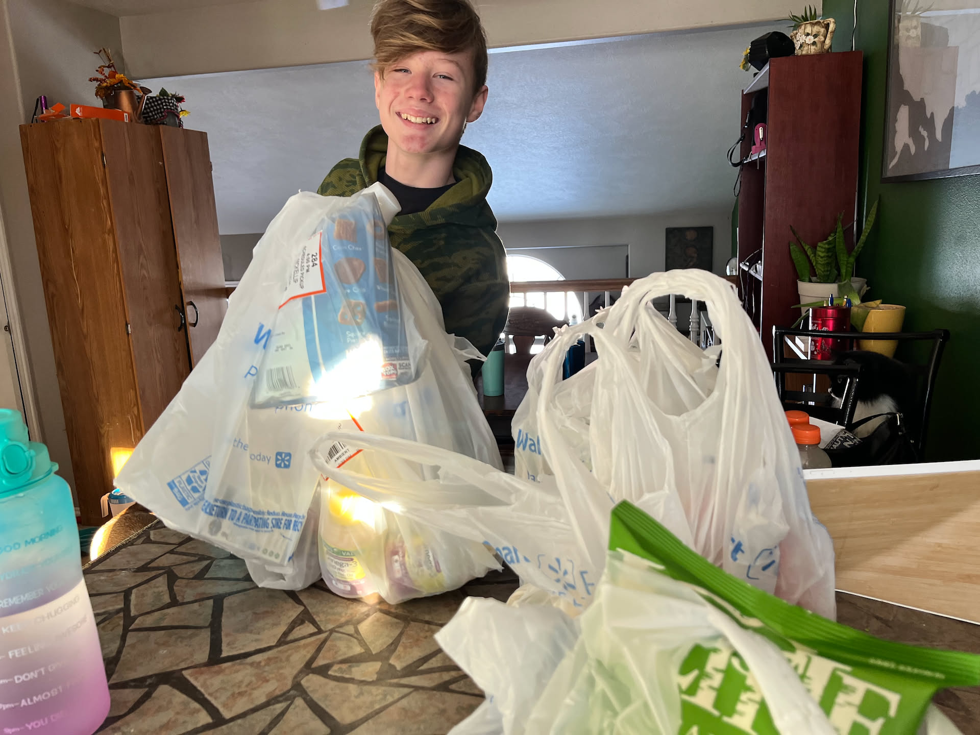 Deanna left a bit early to pick up groceries from Walmart… Avery helped bring them in.