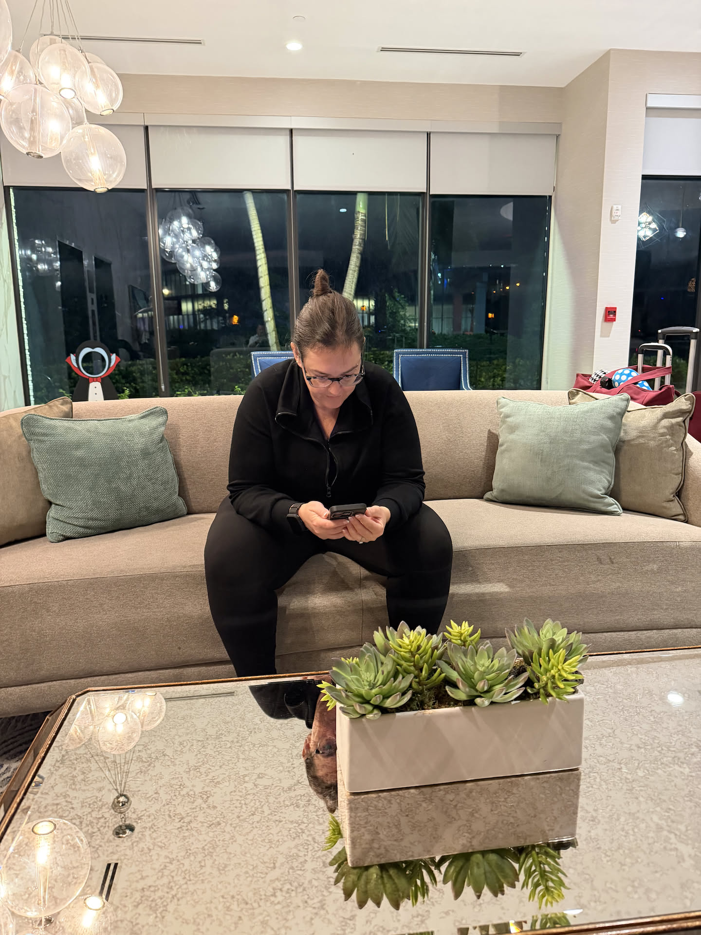 Waiting in the lobby for our Uber driver.