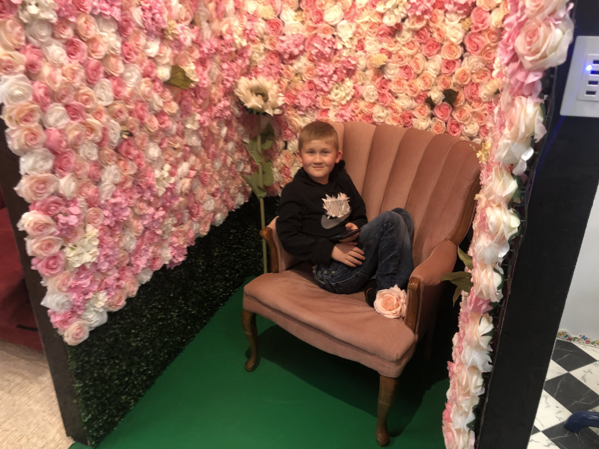 Ethan just hanging out in the flower station watching TikTok on his phone.