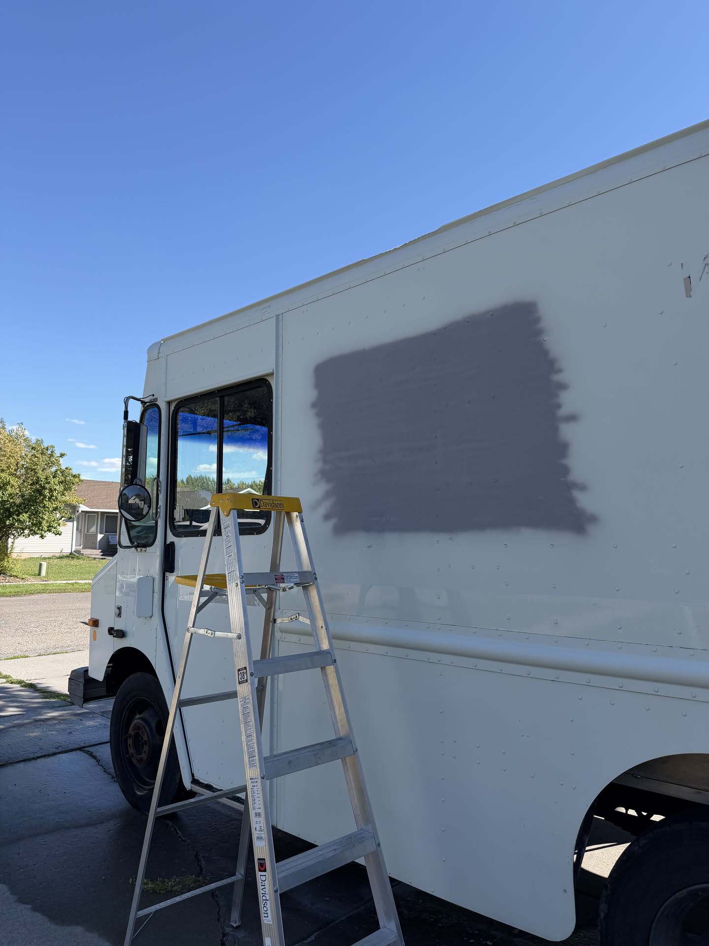 Scrape the logo off and primed it up getting it ready for paint.