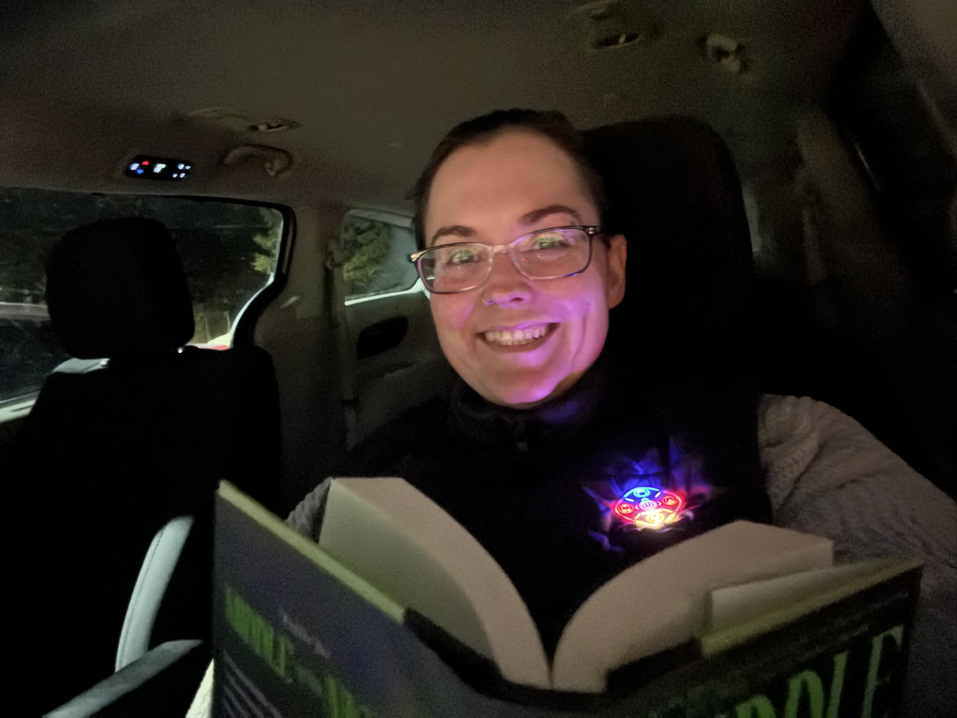 Avery has a very late practice tonight (hockey)… so Deanna took her book and her heated vest and is staying warm in the car while he practices.