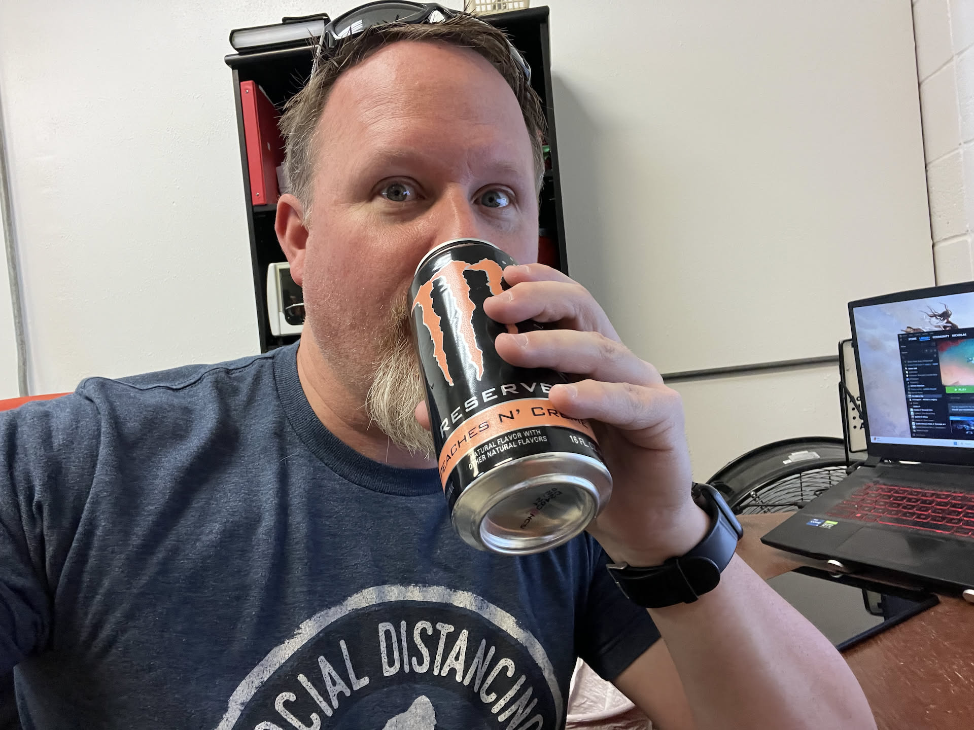 Nick is starting the morning off with an energy drink because it is beautiful outside and he wants to work on the van.