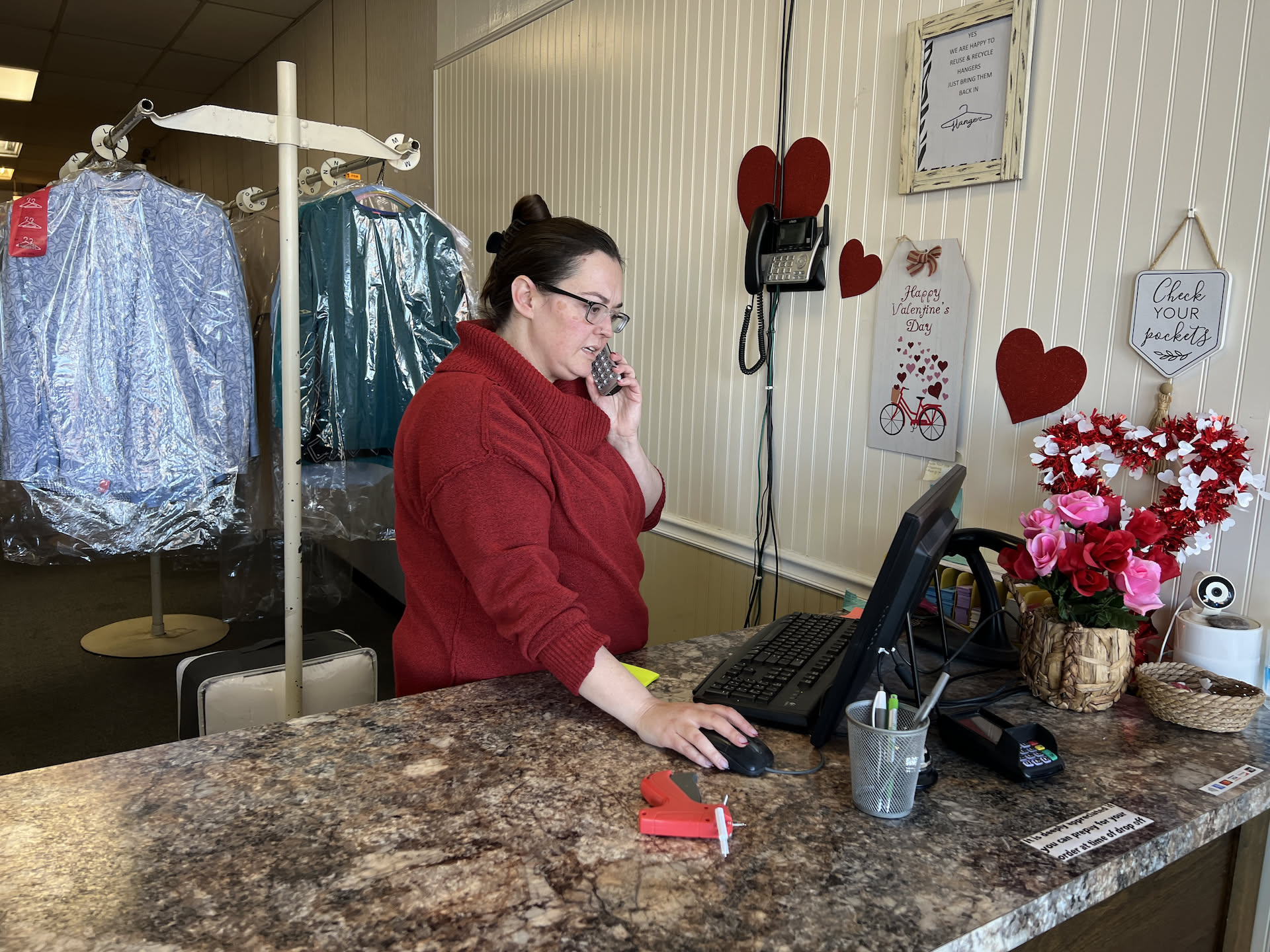 Deanna working hard on both sides.., this is her on the Dry Cleaning side helping a customer on the phone.