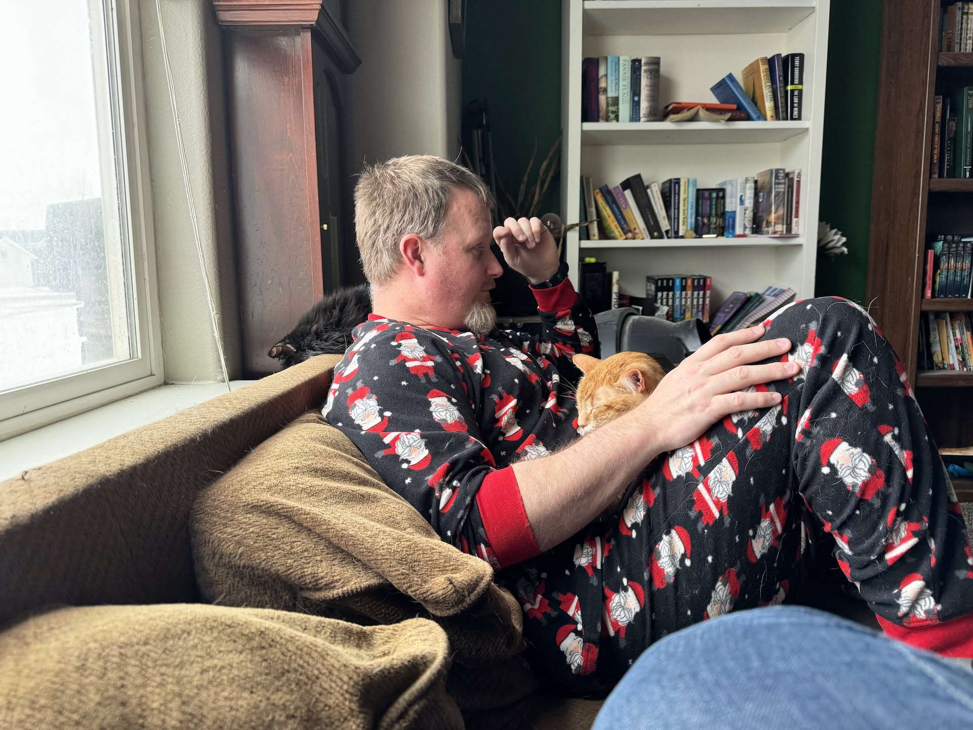When Nick got home, he didn’t want to do anything, so he showered, and put pajamas on. Gotta love how the cats have to cuddle in.