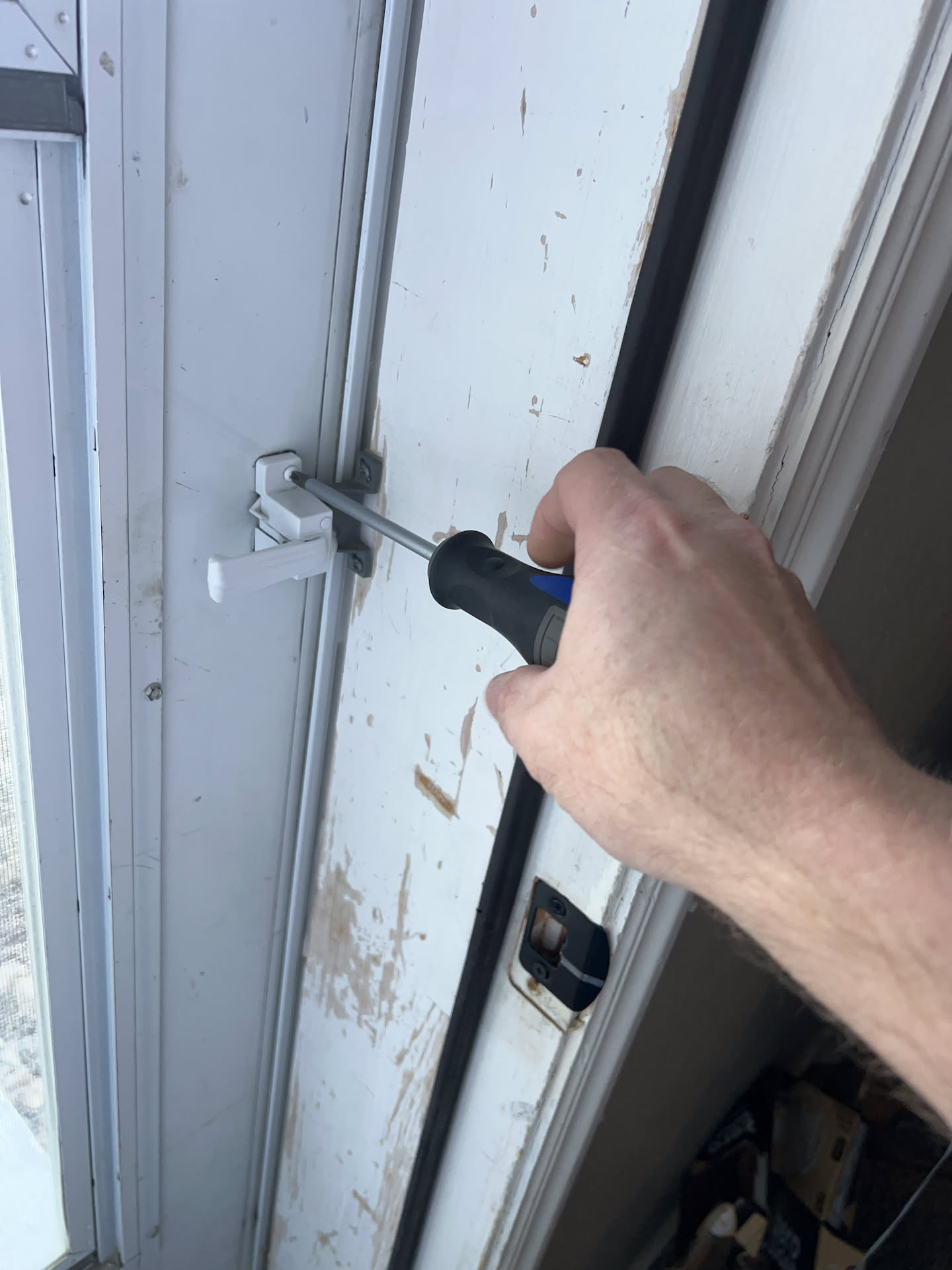 When taking food out to the car, Nick noticed the door coming apart, so he fixed that real quick before he left.