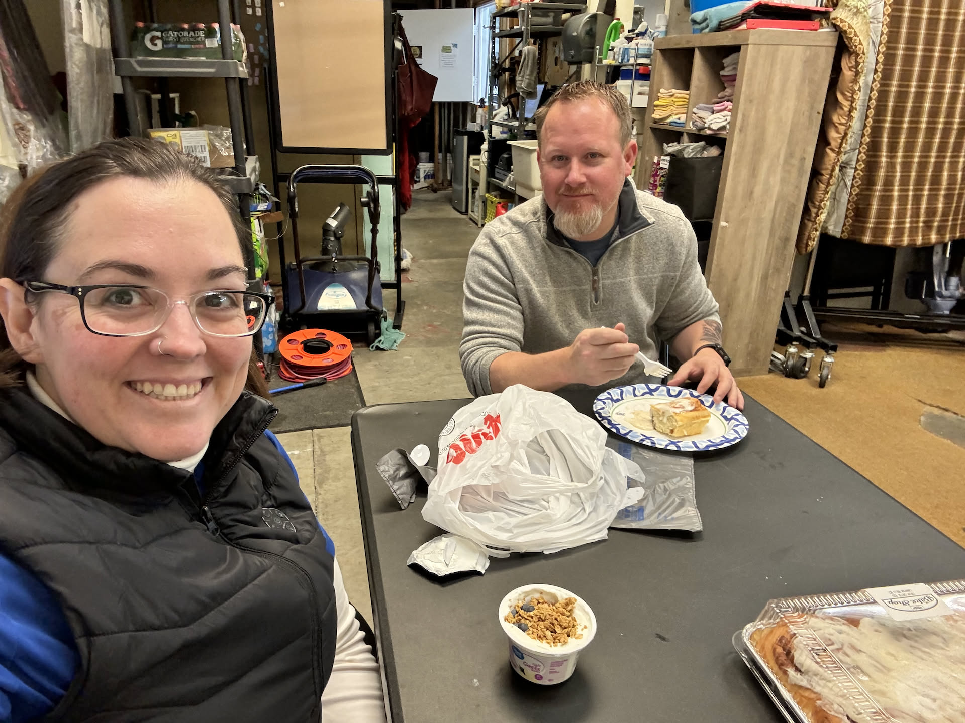 After a little work, Nick and Deanna sat down and had some breakfast… Nick with a cinnamon roll and Deanna with some yogurt.
