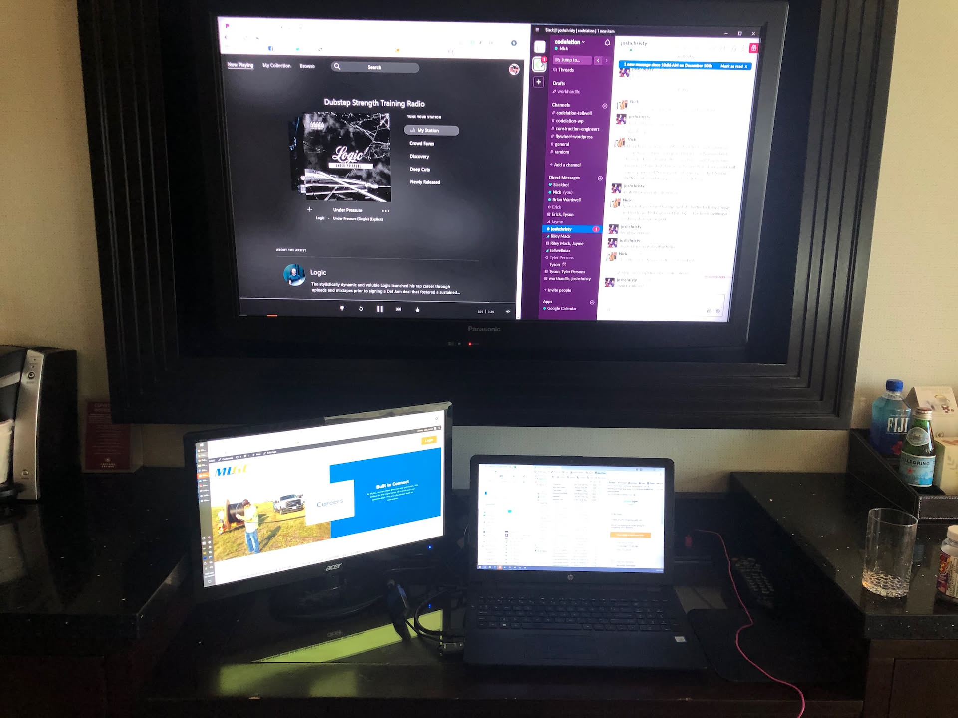 This is my office I setup in our hotel room to work from… why not use the TV as an extra monitor?