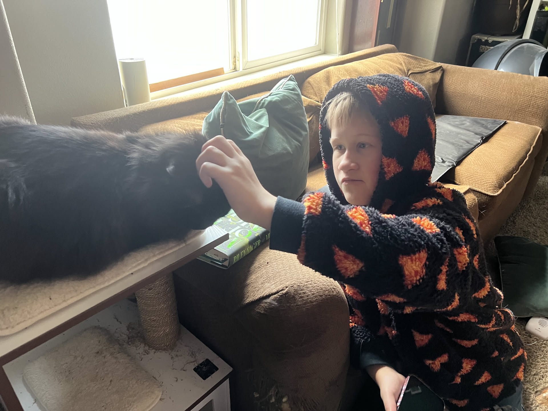 Ethan petting Gotham while he waits for us to leave.