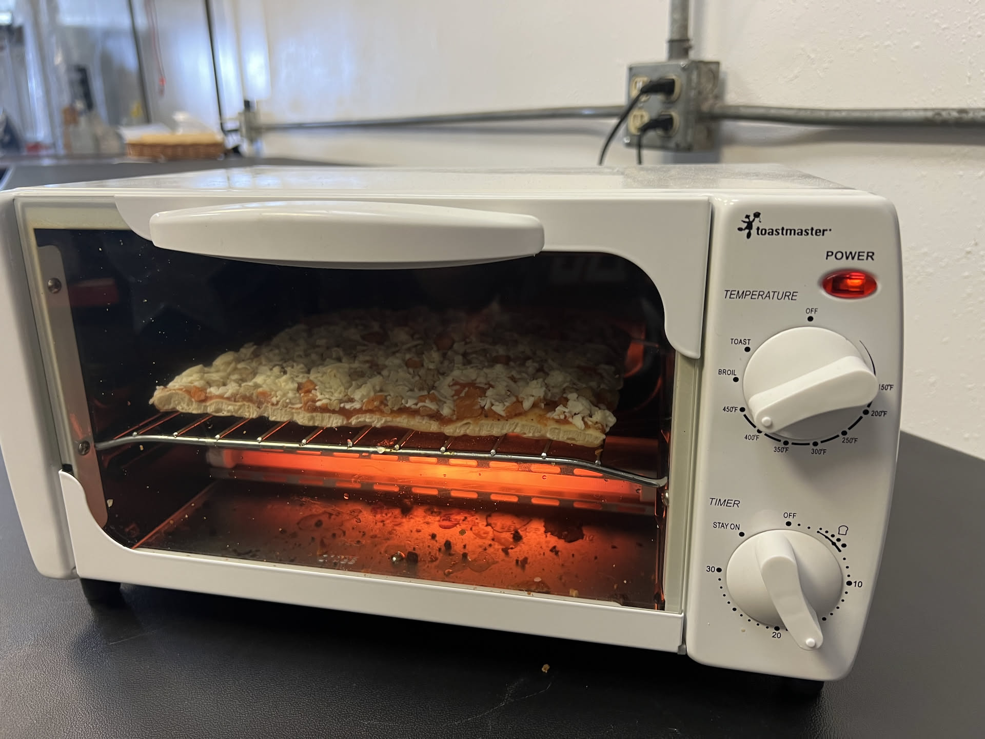 Lunch time, Nick made himself a frozen pizza in the free toaster we got from the road.