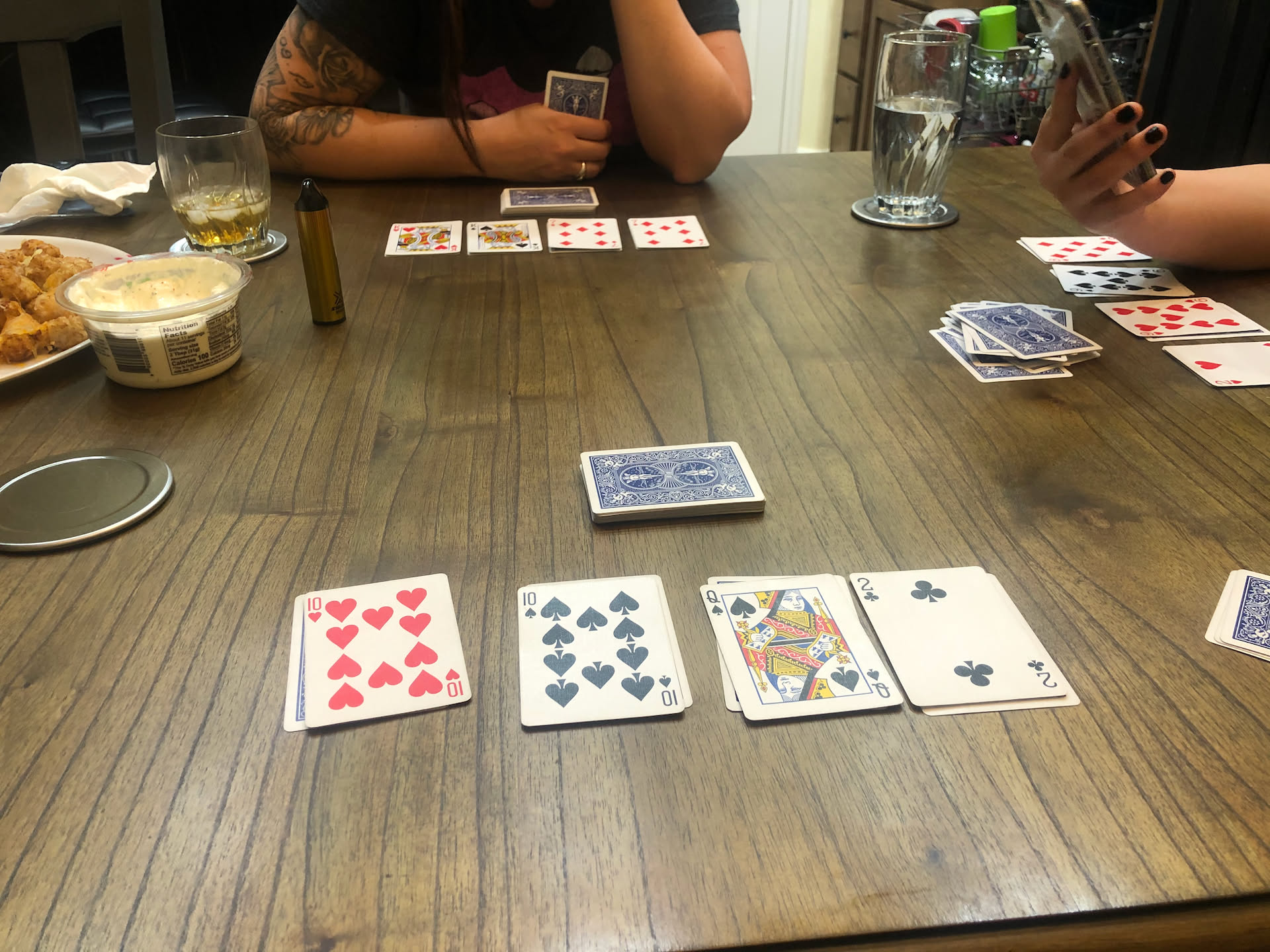 The girls (Deanna, Ashleigh, and Airalynn) playing cards.