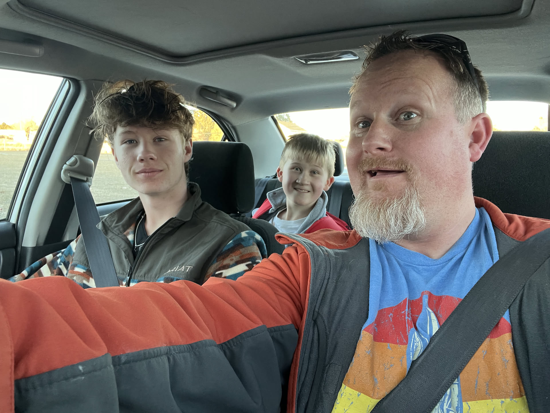 After cooking, Avery and Nick piled into the car and ran to pick up Ethan.