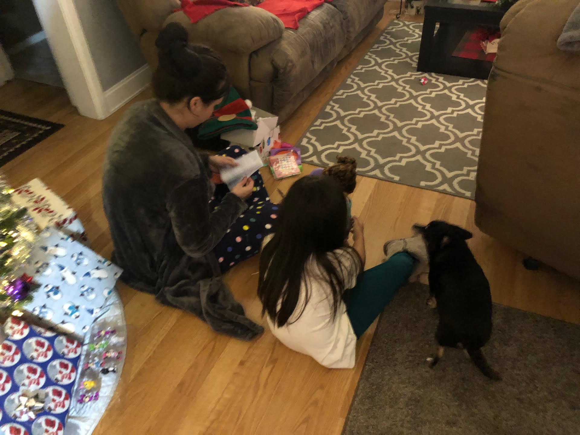 Mom and daughter looking at her gifts.