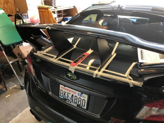 After doing a lot more work to the car… we finished by measuring and installing the wing stabilizers.