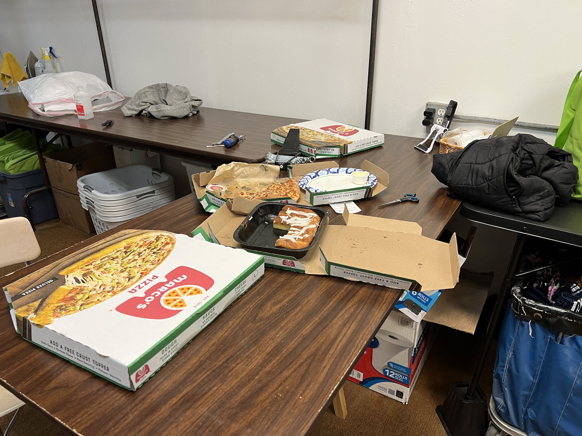 Deanna got us some pizza for dinner. Mixed in is the tools I’ve been using to work on the change machine once again… think we might have figured out what is wrong with it.