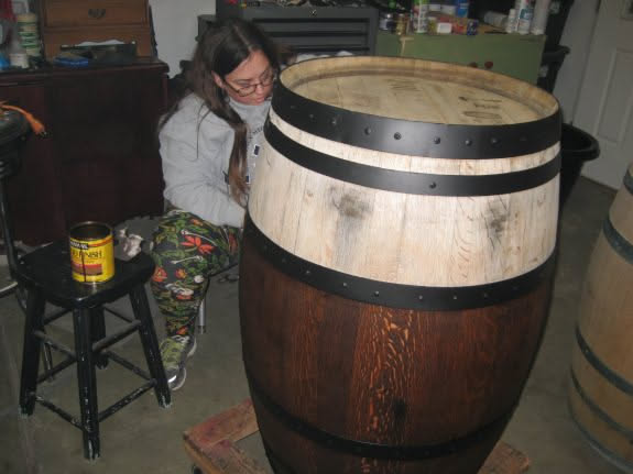 Deanna is working on the staining of one of the barrels.