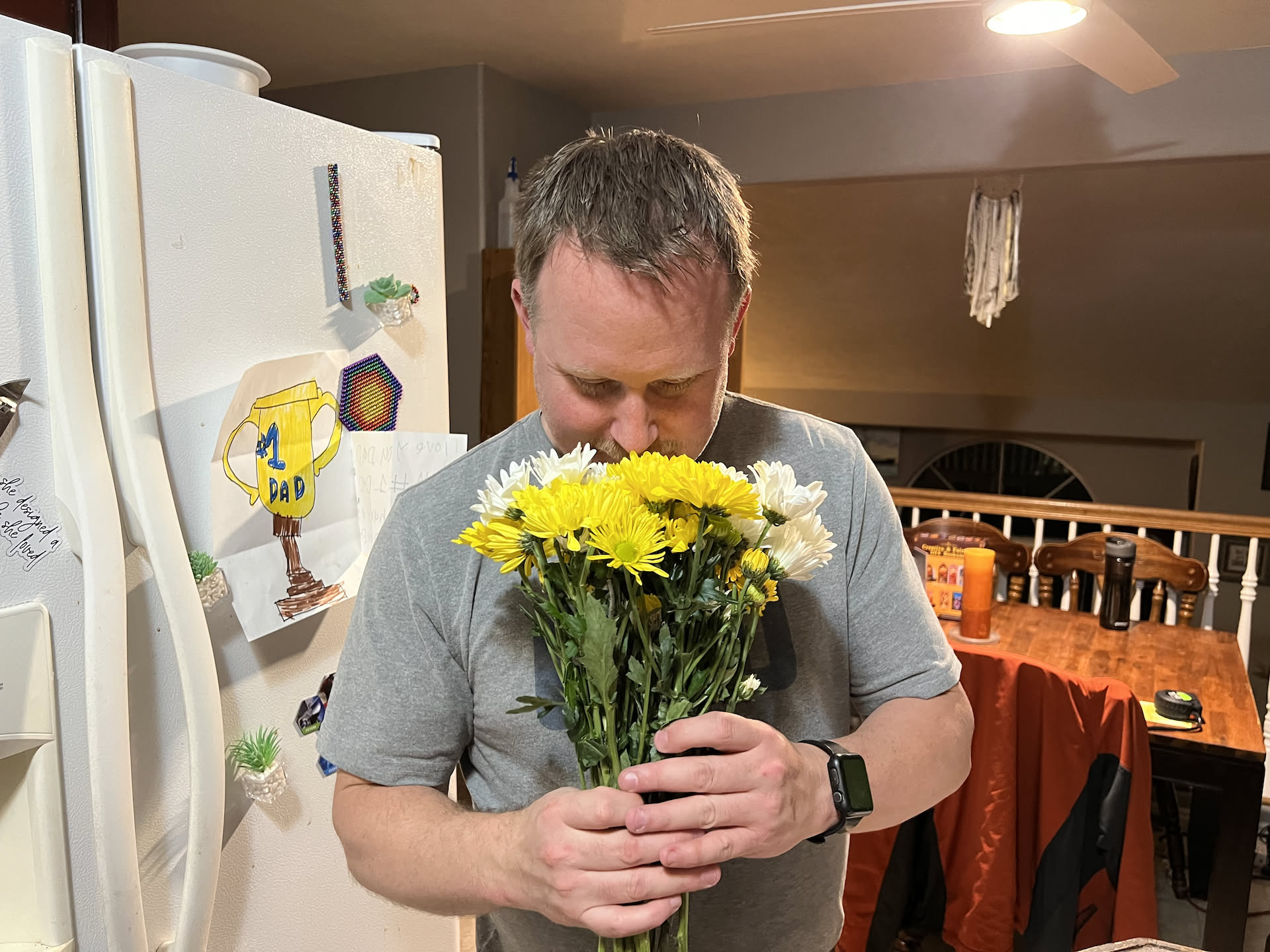 When Nick got home, Deanna gave him the flowers she bought him.