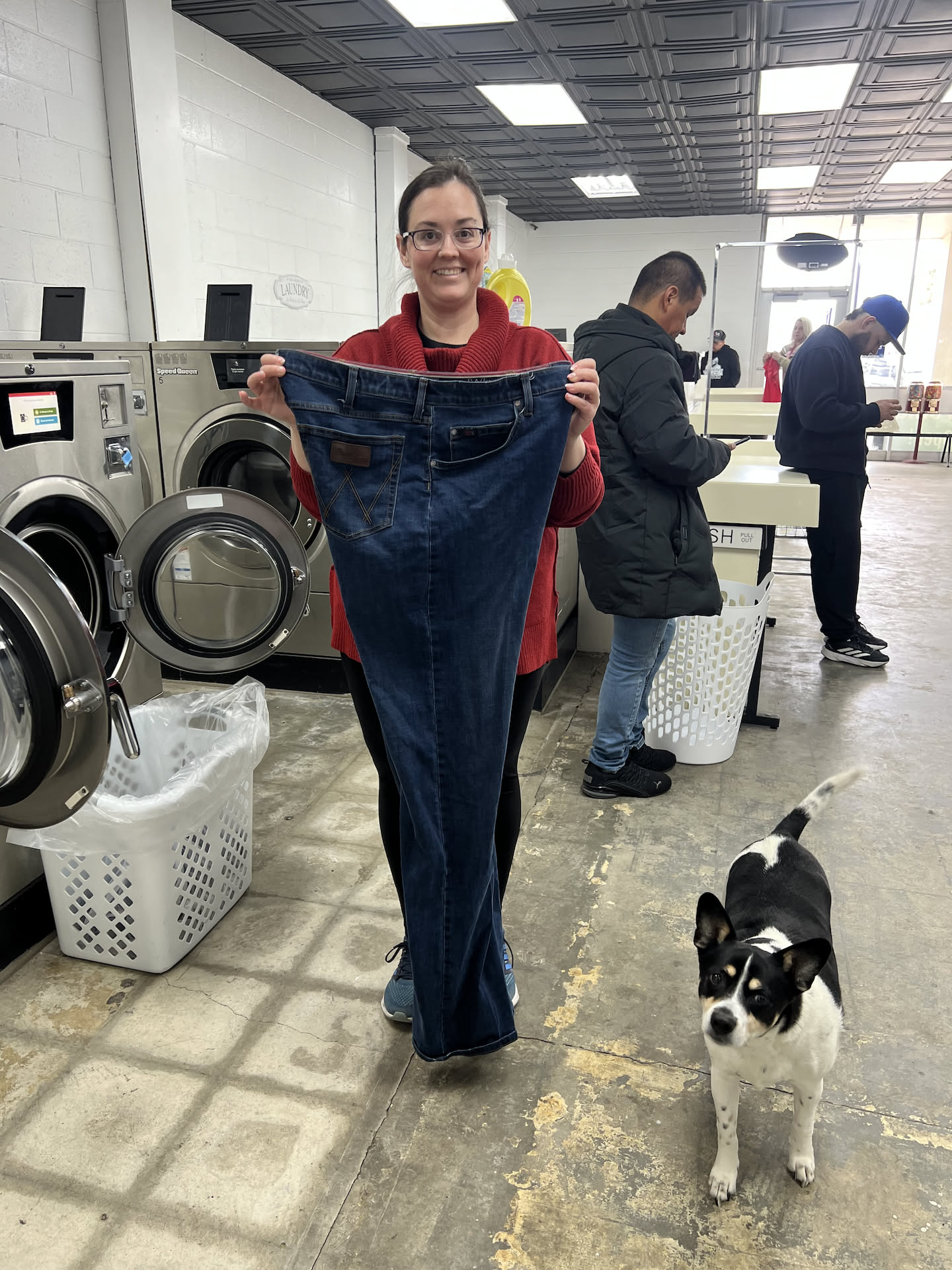 Deanna was working on one of our cowboy pants order… look how tall this person must be (of course the dog had to pose too).