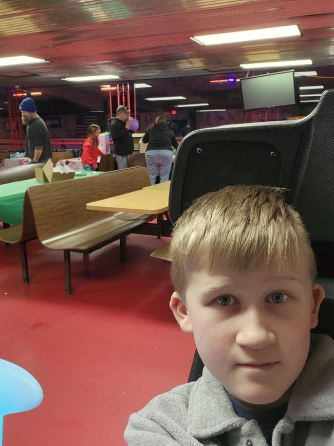 Nick dropped Ethan off, and he took a pic of him sitting there waiting for the birthday kid to arrive.