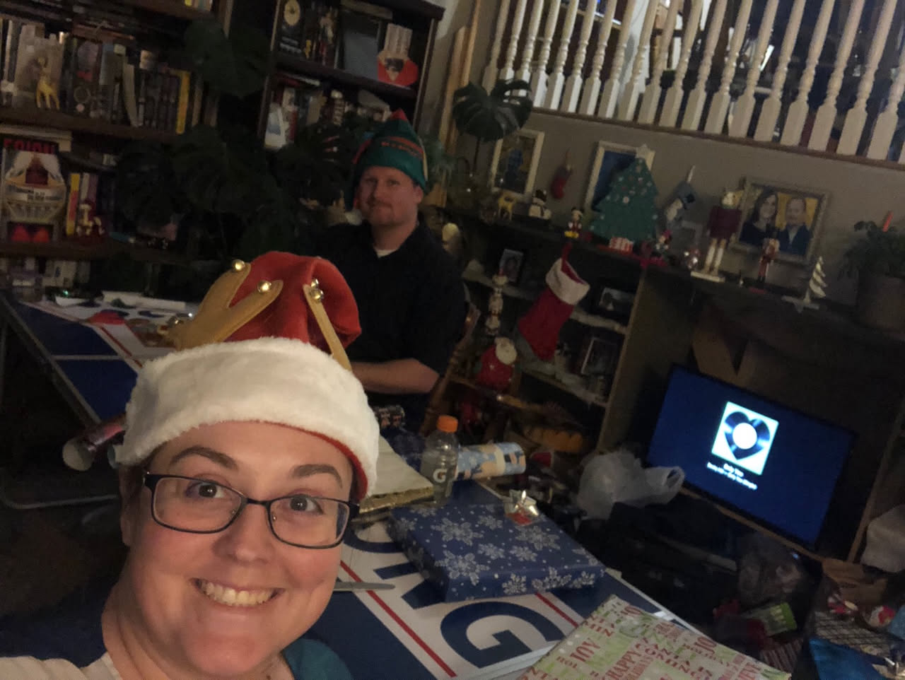 Wearing our elf hats while wrapping.