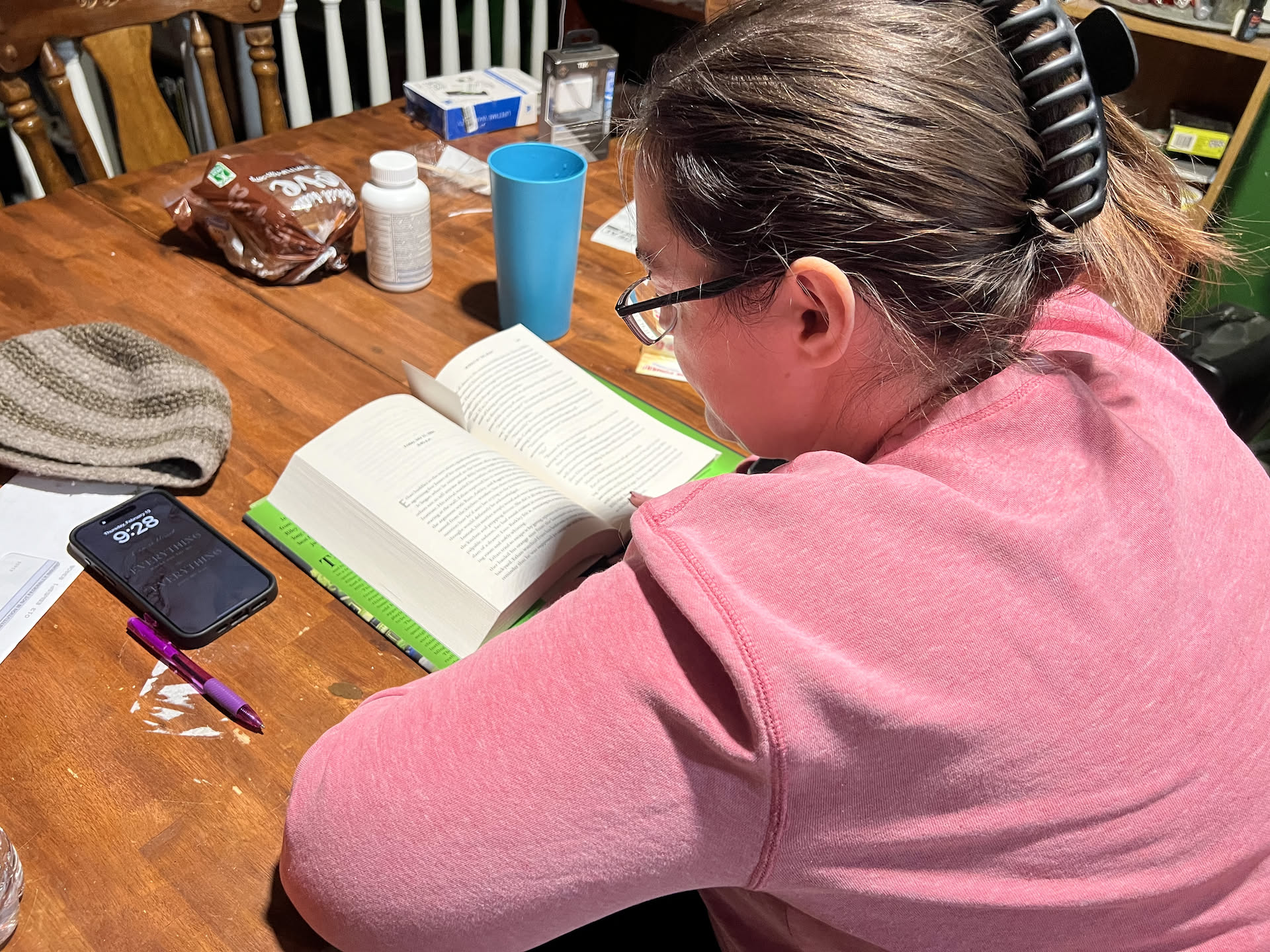 Deanna has really into the book Nick got her for Christmas… so while he cooked, she read.